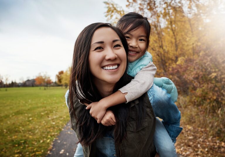 Healthy mom and daugher smiling