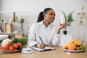 Doctor woman looking at supplement and performing testing