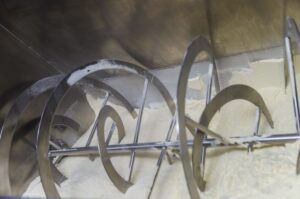 Supplement powder manufacturing facility with quality control and moisture management systems