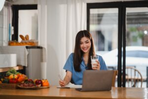 Woman working at work drinking a functional protein drink