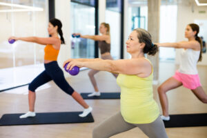 Women working out in a group fitness class.